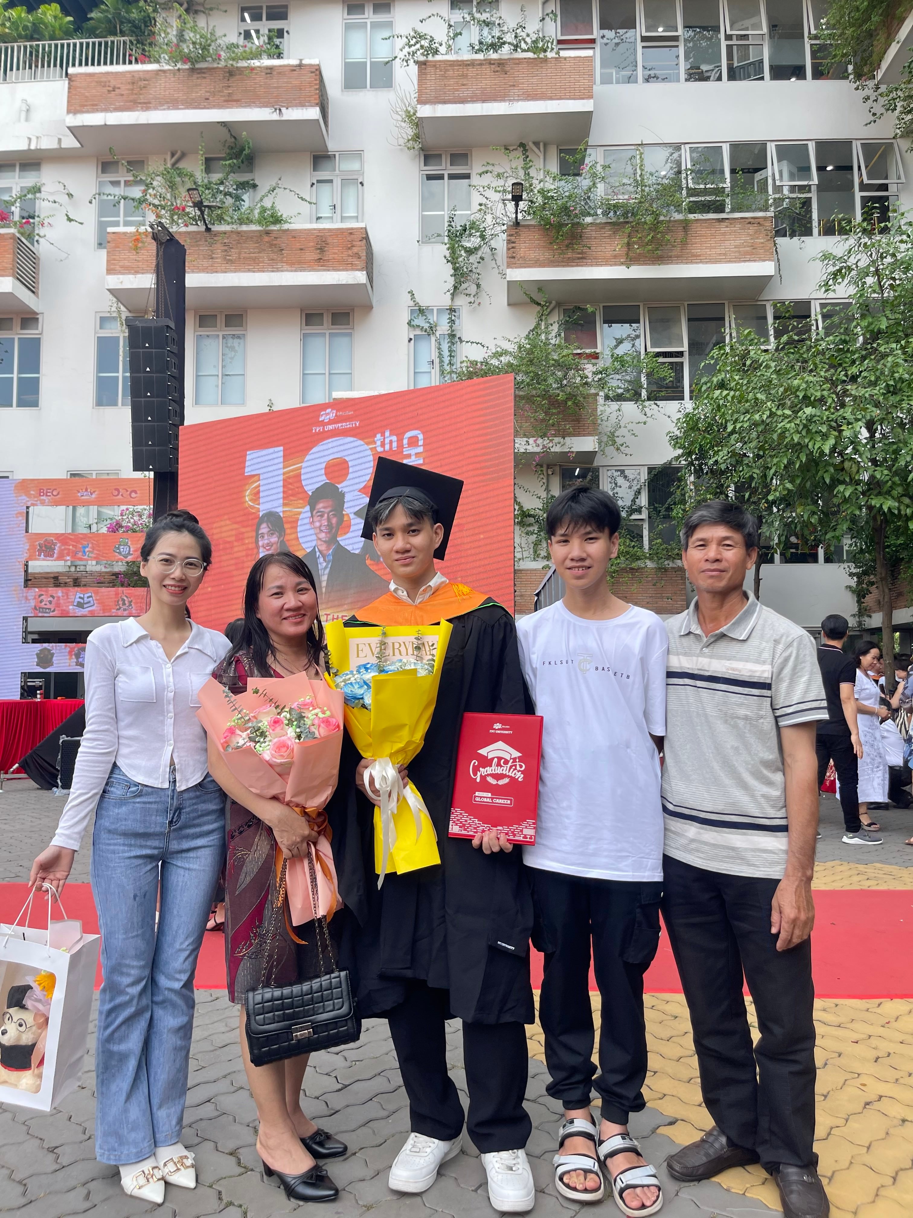Family members at a graduation ceremony.